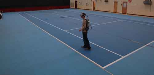 Figure 1 A test subject walking with a HMD backpack in the HIVE gym